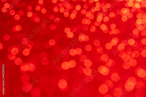 Abstract blurred bokeh lights on red background. Valentine's Day Birthday Wedding Christmas and new year holidays light