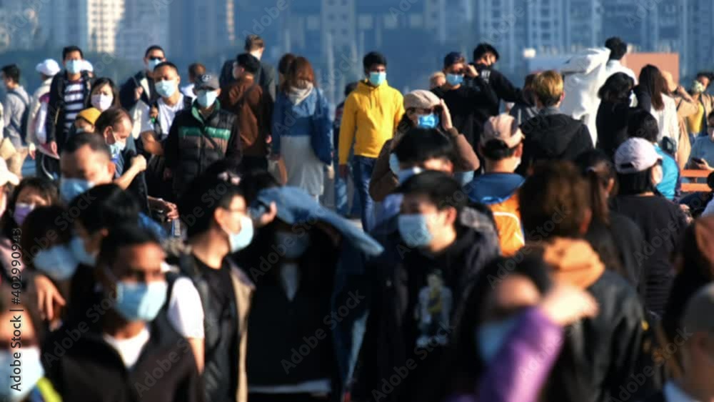 Slow motion of unrecognized people wearing medical face mask in Hong Kong. Coronavirus concept Slow motion of unrecognized people wearing medical face mask in Hong Kong. Coronavirus concept