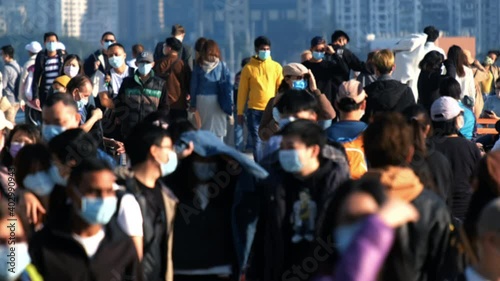 Slow motion of unrecognized people wearing medical face mask in Hong Kong. Coronavirus concept