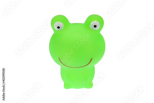 Green toy frog. On a white background, isolated.