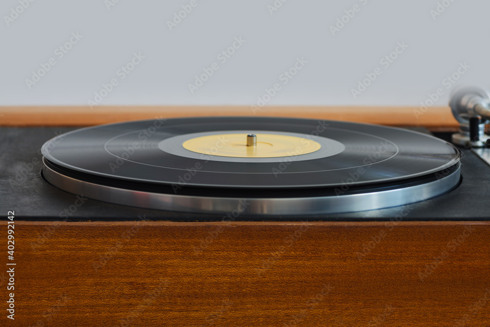 Turntable with a vinyl record on it. Turntable with a vinyl record on it.