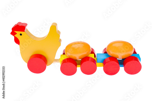 Wooden toy, chicken and eggs. On a white background, isolated.