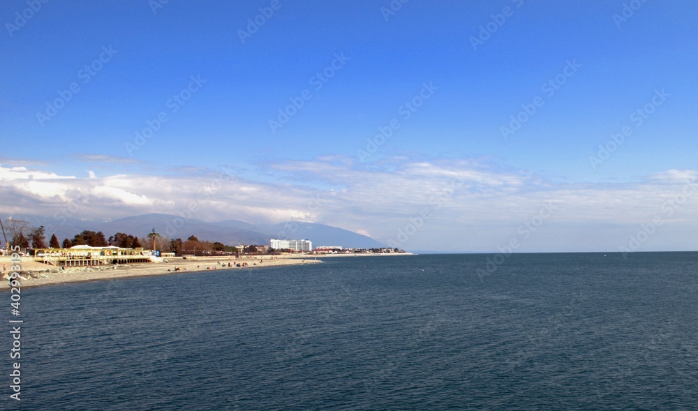Embankment of a seaside resort town overlooking the sea and mountains