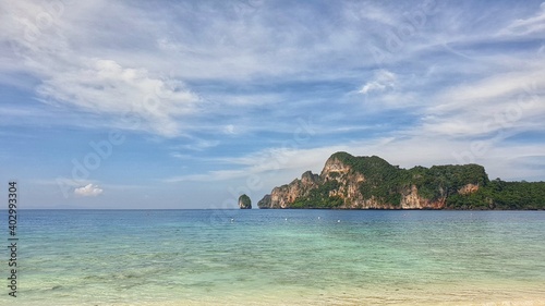 panoramic view of beautiful turquoise sea water with blue sky at Monkey Bay where is one of famous beach in Krabi Island, Thailand
