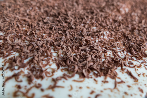 chopped dark chocolate on a cake close-up