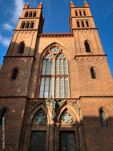 Low angle view of Neo-Gothic church Friedrichswerdersche Kirche, designed by architect Karl Friedrich Schinkel located in Berlin, Germany. photo