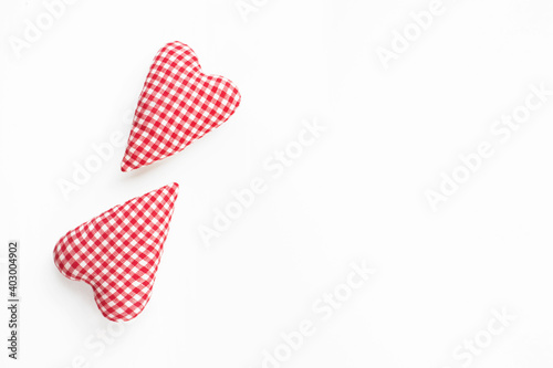 Valentines day composition. Two soft red hearts on white background. Flat lay, top view, copy space