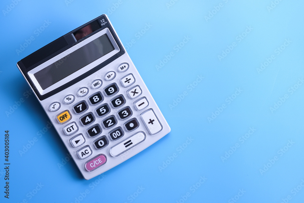 Calculator keypad on a blue background. Top view. Copy space Calculator keypad on a blue background. Top view. Copy space