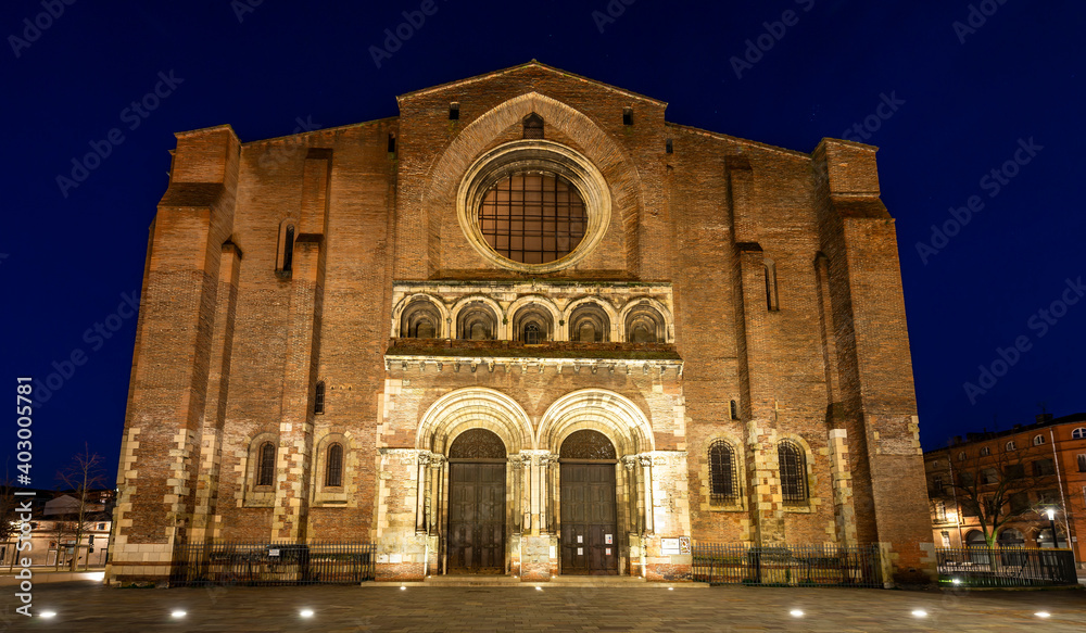 The Basilica of Saint Sernin illuminated at night, in Toulouse in Occitanie, France