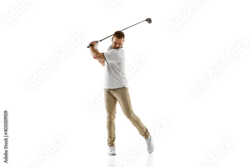 Impressed. Golf player in a white shirt taking a swing isolated on white studio background with copyspace. Professional player practicing with bright emotions and facial expression. Sport concept.