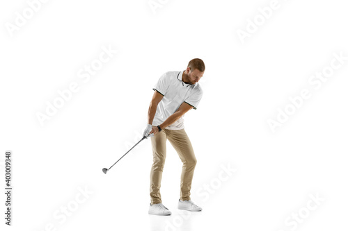 Balance. Golf player in a white shirt practicing, playing isolated on white studio background with copyspace. Professional player practicing with bright emotions and facial expression. Sport concept.