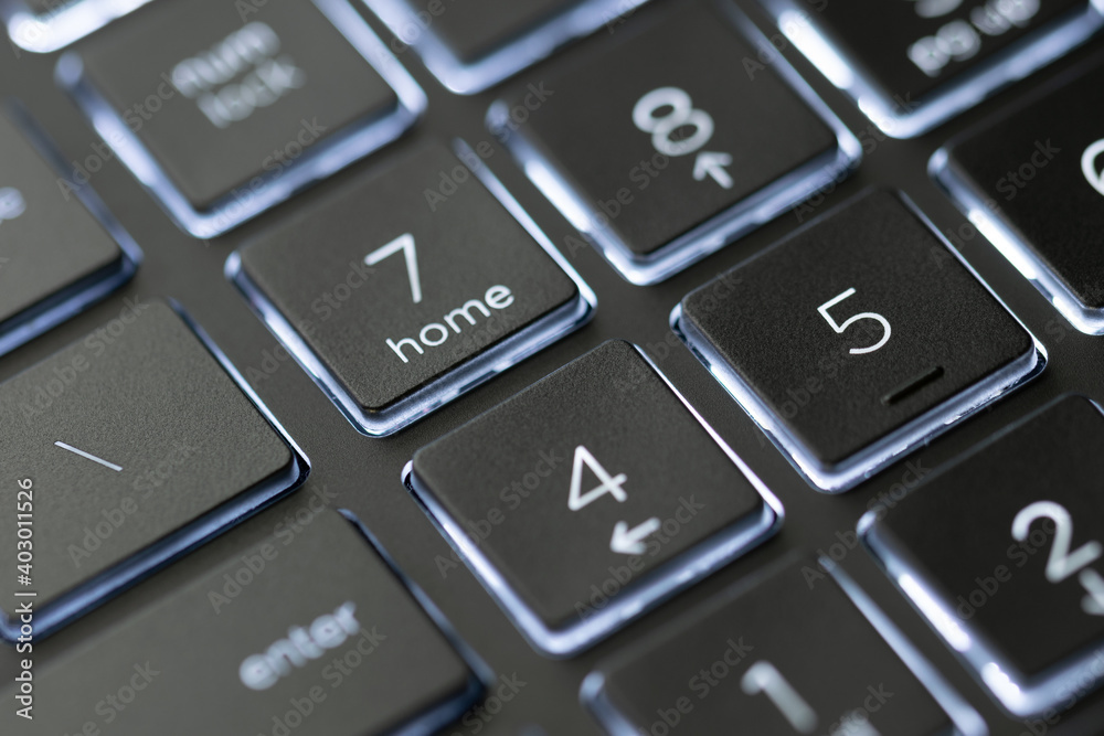 Illuminated, defocused laptop keyboard. Informatics background. Illuminated, defocused laptop keyboard. Informatics background.