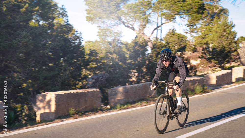 Fototapeta premium cyclist with race bike on the road