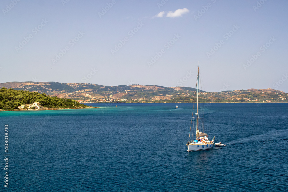 yacht sailing out of Argostoli with beautiful hills in background