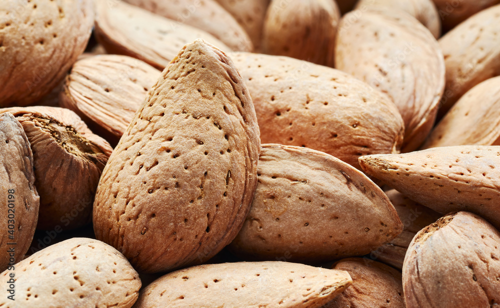 Close up picture of raw shell almonds, selective focus. Close up picture of raw shell almonds, selective focus.
