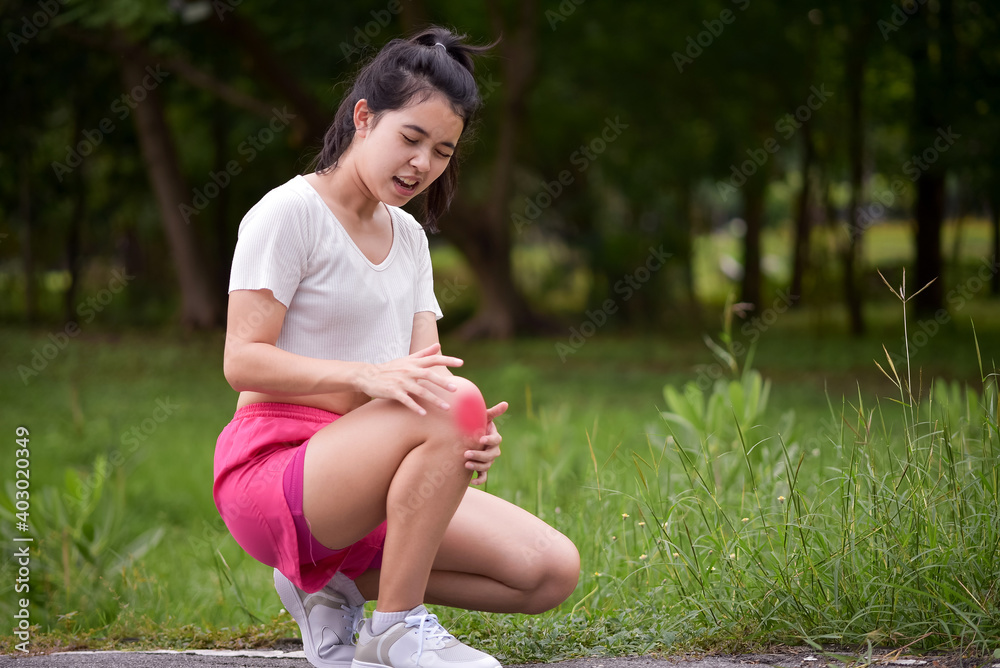 Asian woman is warm up, To make the muscles flexible Before going to jogging for good health and energy metabolism,Outdoors cross training workout. Healthcare concept Asian woman is warm up, To make the muscles flexible Before going to jogging for good health and energy metabolism,Outdoors cross training workout. Healthcare concept
