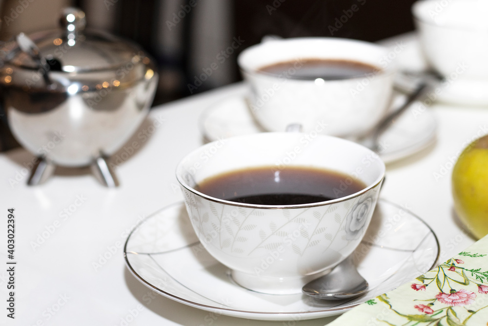 a cup of coffee on the table a cup of coffee on the table