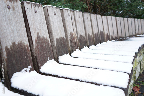 snow covered fence