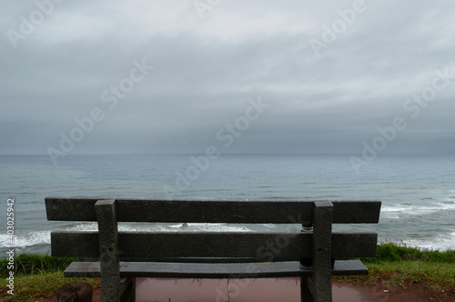 Empty bench front the sea, back view