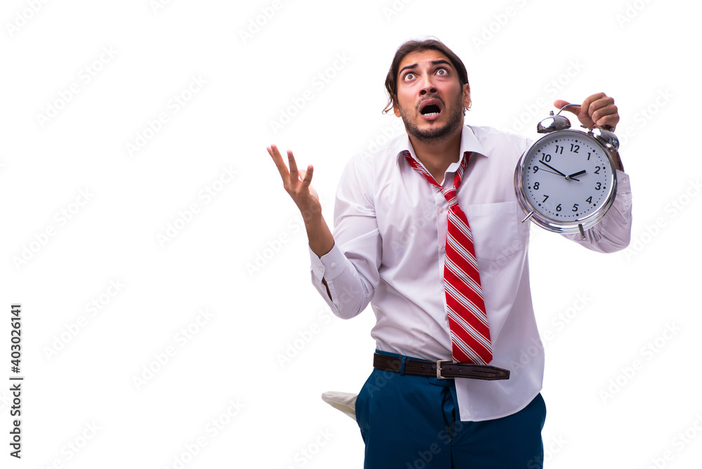 Unhappy young male employee in time management concept Unhappy young male employee in time management concept