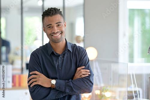 Portrait of african american businessman in co-working office photo