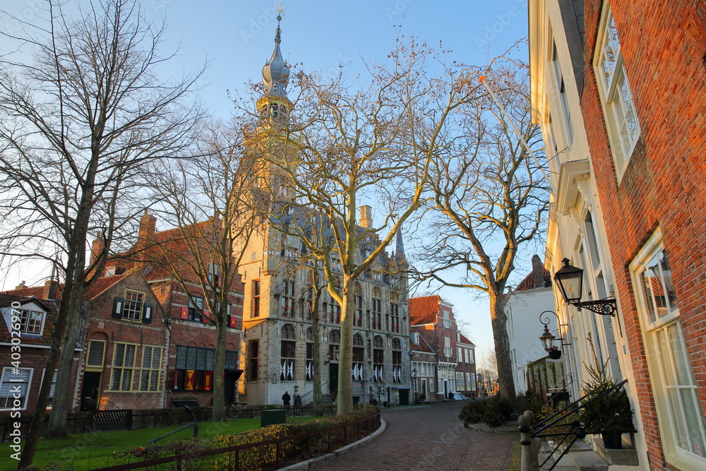 The main Square (Markt) with traditional medieval houses and the Stadhuis (town hall) with its impressive clock tower in Veere, Zeeland, Netherlands