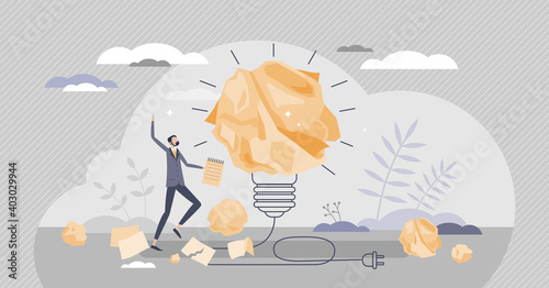 Inspiration or creative idea as crumpled paper light bulb tiny person concept