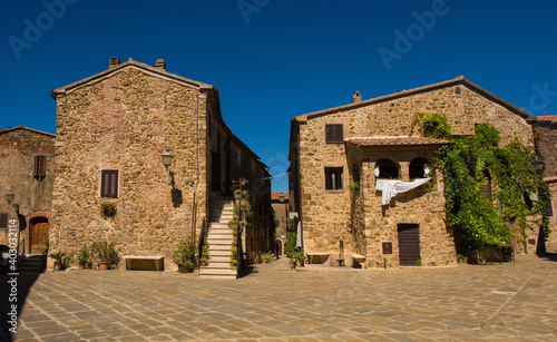 Historic stone residential buildings in the village of Montemerano near Manciano in Grosseto province, Tuscany, Italy 