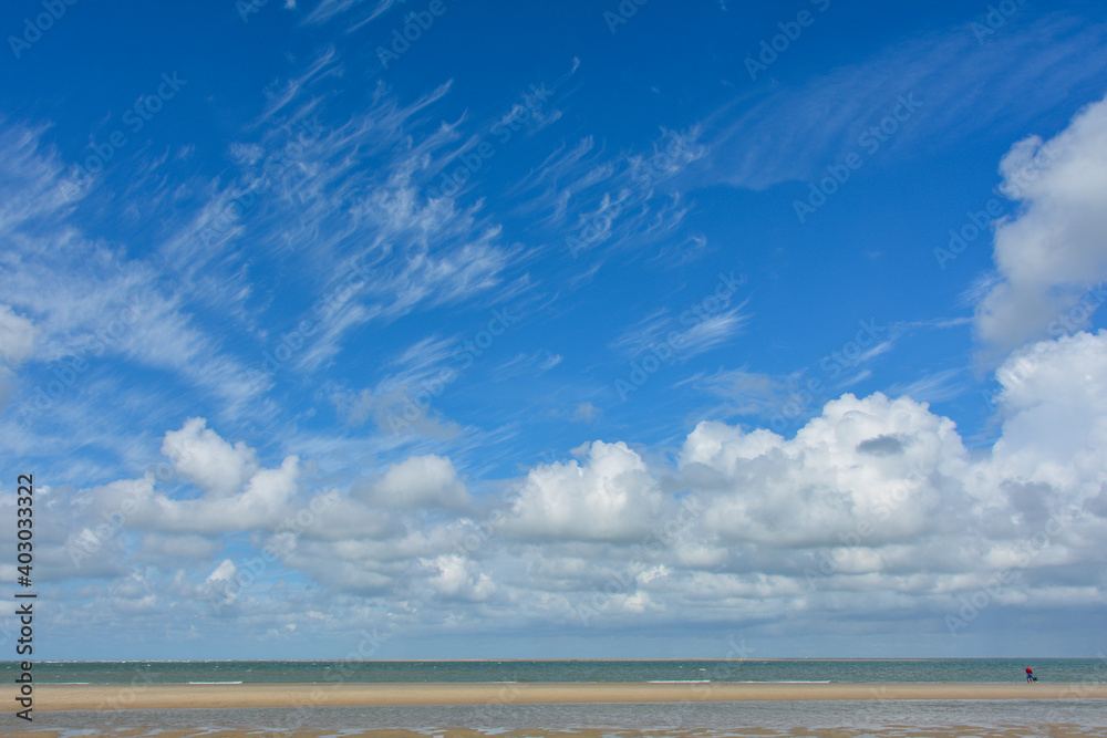Beach by the sea with clouds on the  sky