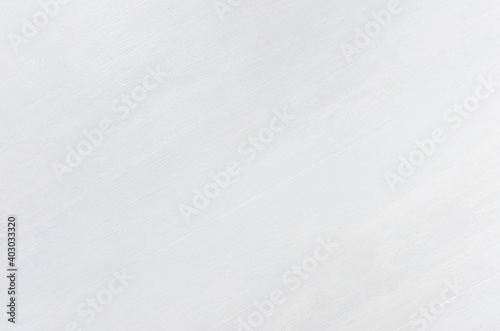 White wooden painted board with diagonal planks, top view, texture.