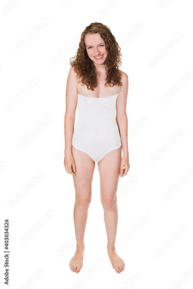 Full length portrait of an attractive laughing woman wearing a white swimsuit, studio photo isolated in front of bright background Full length portrait of an attractive laughing woman wearing a white swimsuit, studio photo isolated in front of bright background