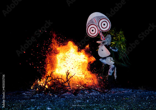 Dancer with a giant mask during a Baining tribe fire dance, East New Britain Province, Rabaul, Papua New Guinea photo