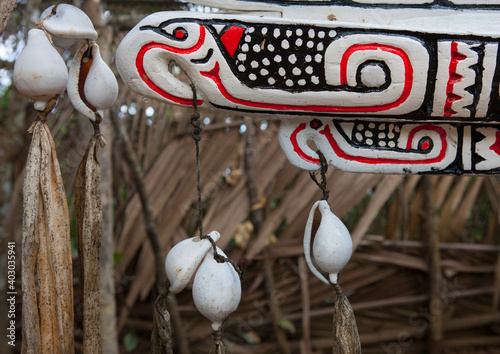 Traditional canoe with carved and painted decorations, Milne Bay Province, Alotau, Papua New Guinea photo