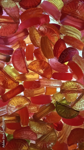 Colored sweet candy in bulk against light
