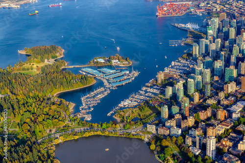 Aerial view of Coal Harbour and a modern Downtown City during a vibrant sunny morning. Taken in Vancouver, British Columbia, Canada.