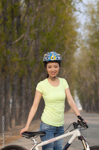 A young beauty women on a bicycle 