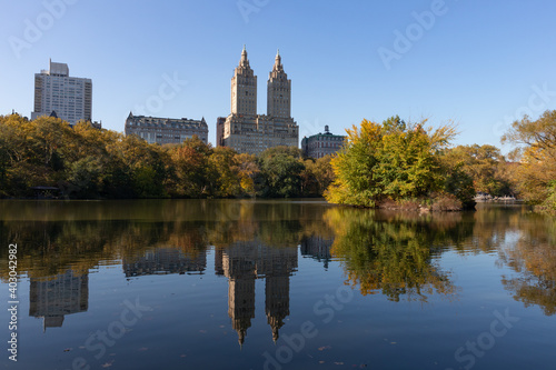 The Lake at Central Park during Autumn with the Upper West Side Skyline Reflection and Colorful Trees in New York City