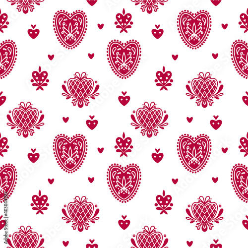 Abstract folk seamless pattern with decorative elements and hearts