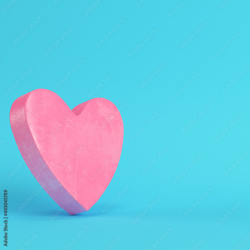 Pink abstract heart shape on bright blue background in pastel colors