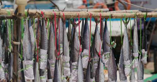 salted fish hanging on the boat
