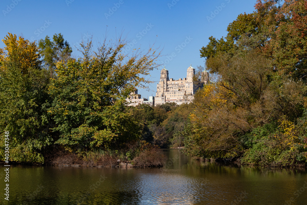 The Lake at Central Park during Autumn with the Upper West Side Skyline and Colorful Trees in New York City