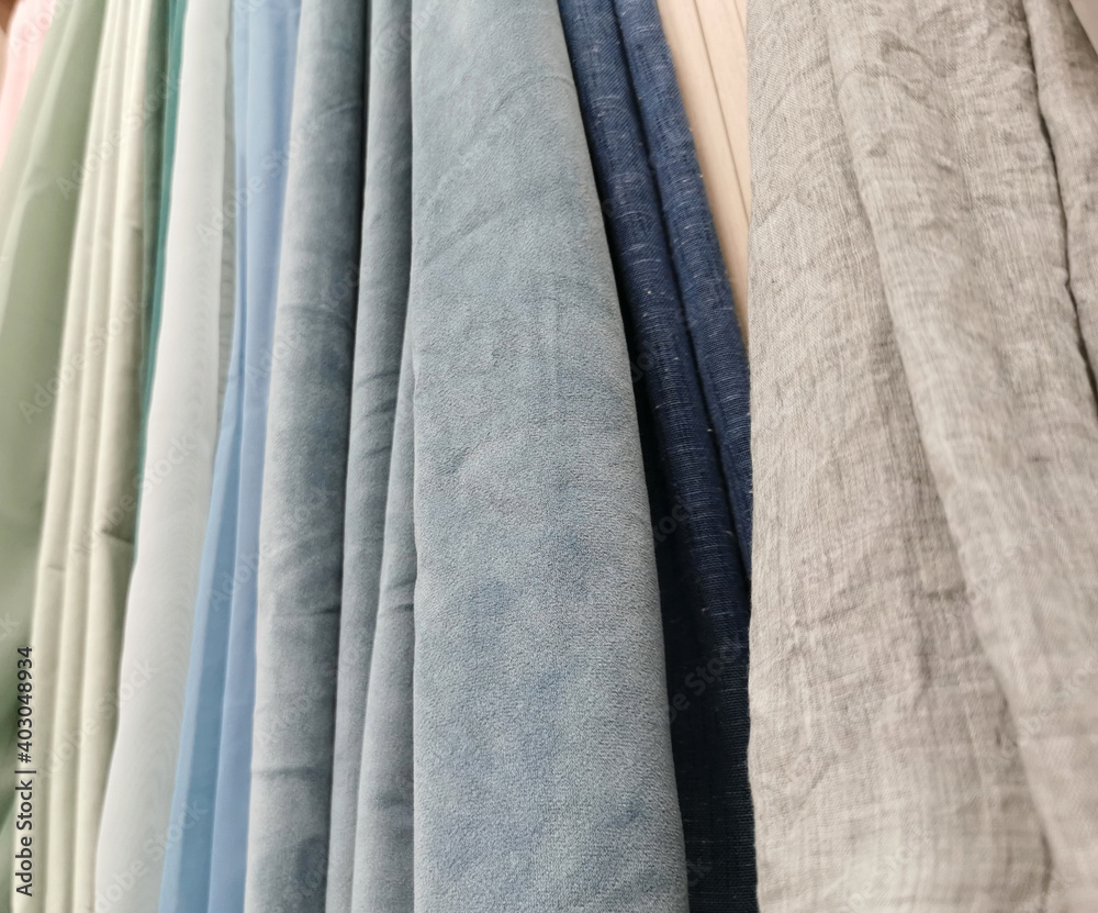 Detailed close up view on samples of cloth and fabrics in different colors found at a fabrics market. selective focus, Detailed close up view on samples of cloth and fabrics in different colors found at a fabrics market. selective focus,