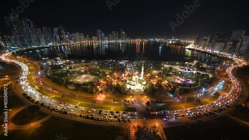 SHARJAH 2021: Stunning Night Timelapse of Sharjah City, Panoramic Khalid Lagoon and city skyline, traffic movement at night, United Arab Emirate. 4k Footage photo