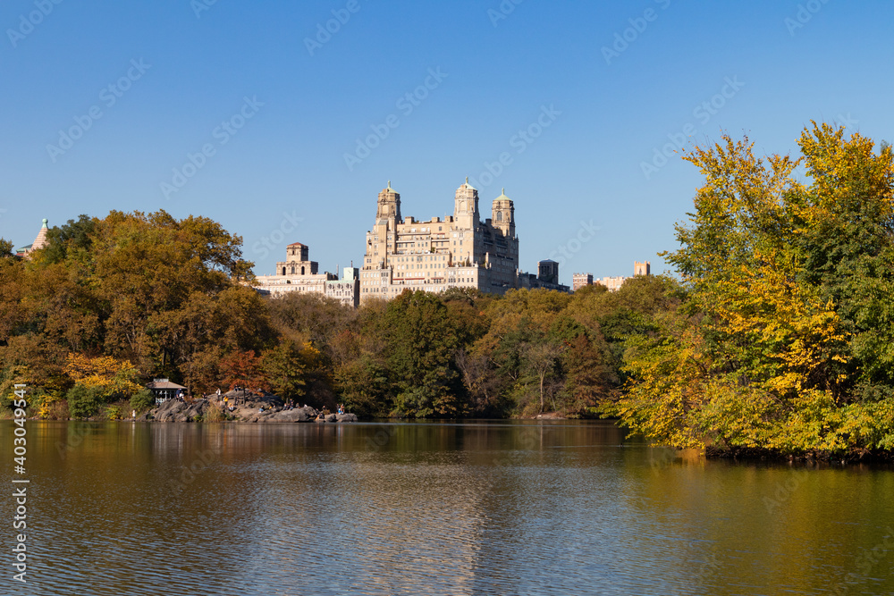 The Lake at Central Park during Autumn with the Upper West Side Skyline and Colorful Trees in New York City