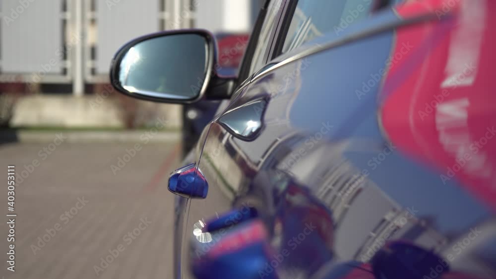 Blue shiny sports business car open side door