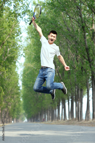 The young man jumping in the park