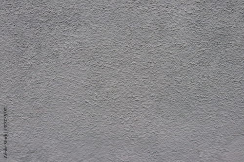 Gray plaster on the wall of the building.