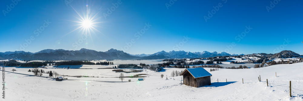 beautiful panoramic landscape wirh mountain range in Bavaria, Germany, at cold winter day