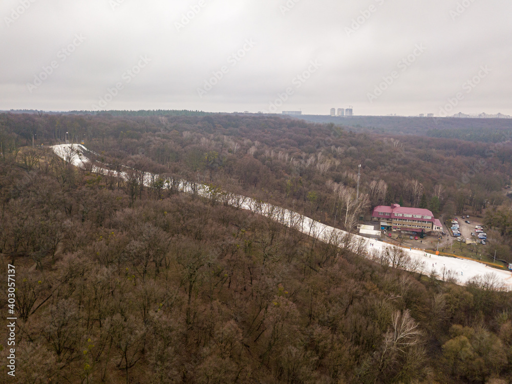 Naklejka premium Aerial drone view. Ski resort. Descent with artificial snow.