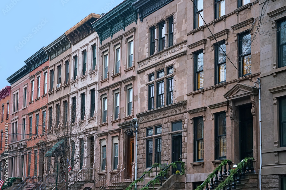 block of old brownstone style apartment buildings